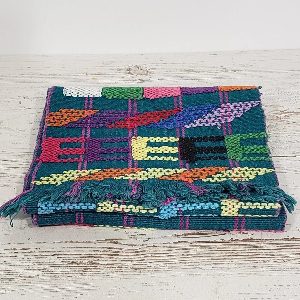 Handwoven Colorful Table Runner Teal background with lots of other colors